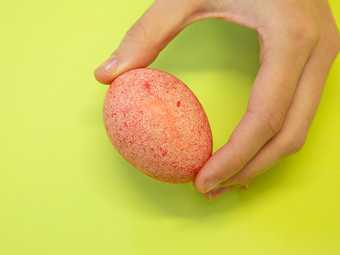 Holding up the final red speckled egg 