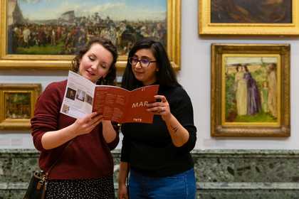 two people look at a map in Tate gallery