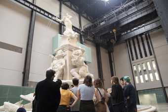 A group gathered around a giant fountain