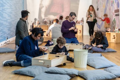 Kids and their parents playing in the Learning Gallery at Tate Britain 