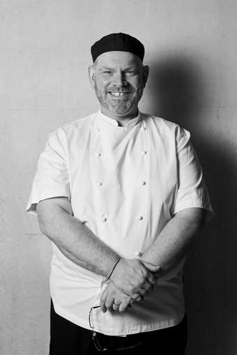 Black and white photograph of head chef Spencer Ralph