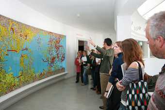 Guided tour at Tate St Ives, curator explains a painting to a group