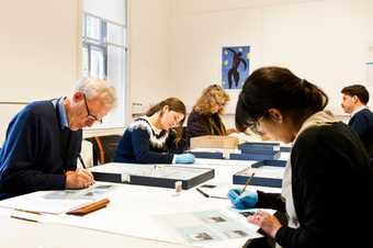 Preservation volunteers working on mixed collections