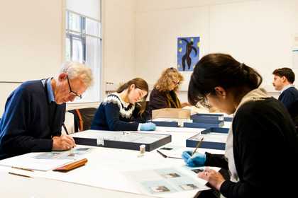 Preservation volunteers working on mixed collections