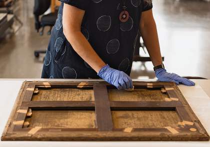Photograph of a conservator at work at Tate