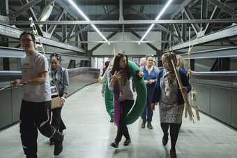 Photograph of attendees of Teachers Course 2018 walking across the bridge in Tate Modern