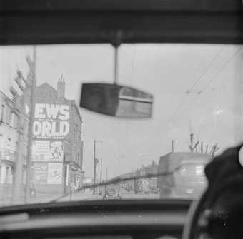 The view from a car looking through the windscreen toward News of the World Building in London