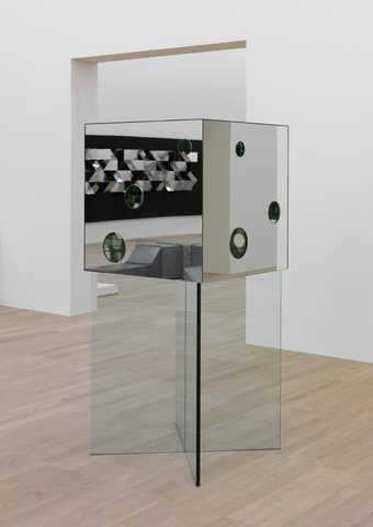 mirrored cube sculpture with holes in 