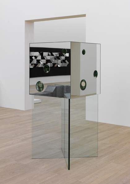mirrored cube sculpture with holes in