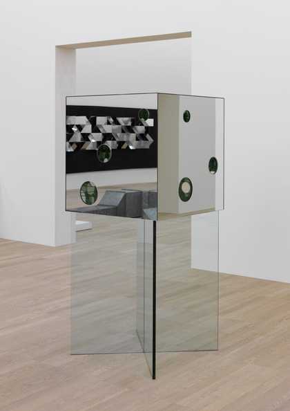 mirrored cube sculpture with holes in