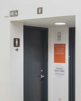 outside signage of the toilet.