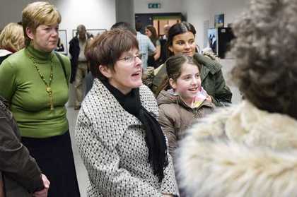 A group on a guided exhibition tour at Tate Liverpool