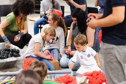 Kids playing with materials in gallery