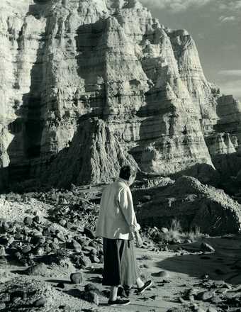 Todd Webb, Georgia O'Keeffe walking at the White Place, New Mexico, 1957