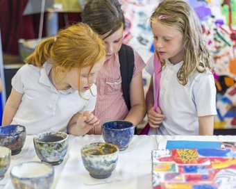 The Town Project Children Looking at Pots