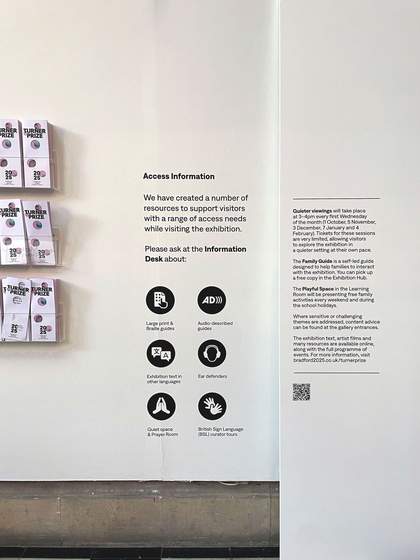 An image of a white gallery wall with text detailing the access information available for the exhibitition