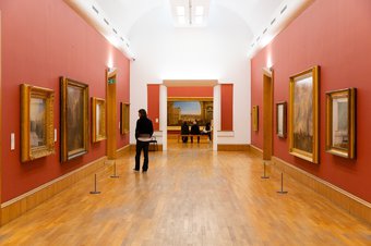 Interior view of the Clore Gallery, Tate Britain with paintings by J.M.W. Turner displayed ion the wall