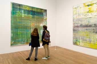 two visitors look at a Richter painting in Tate Modern