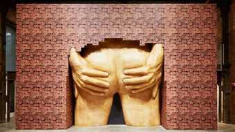 Photograph of a sculpture by Anthea Hamilton of a large bum