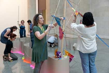 People building a sculpture