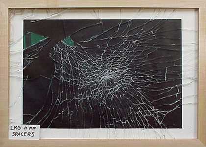 Uneven breakage pattern of standard low reflective glass fitted in a frame with spacers