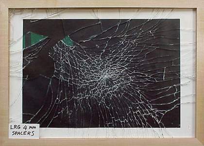 Uneven breakage pattern of standard low reflective glass fitted in a frame with spacers