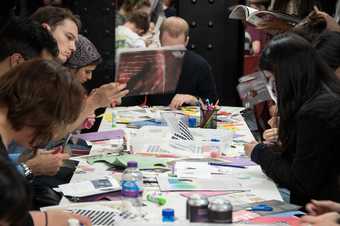 a group do collaging at a table