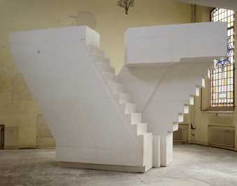cast of some stairs in a warehouse