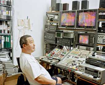 Nam June Paik in his New York studio, photographed by David Heald, 1999