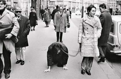VALIE EXPORT walks Peter Weibel on a leash in the performance Aus der Mappe der Hundigkeit From the Portfolio of Doggishness Vienna 1968