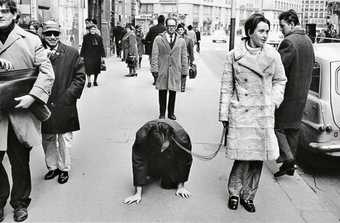 VALIE EXPORT walks Peter Weibel on a leash in the performance Aus der Mappe der Hundigkeit From the Portfolio of Doggishness Vienna 1968