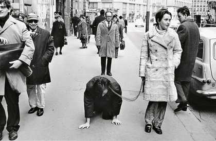 VALIE EXPORT walks Peter Weibel on a leash in the performance Aus der Mappe der Hundigkeit From the Portfolio of Doggishness Vienna 1968