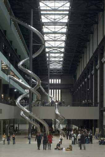 View of Test Site installed in the Turbine Hall at Tate Modern, showing the five spriralling tubular slides that ran from the upper floors of the Gallery to ground level