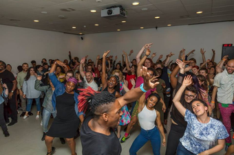People participating in a vogueing workshop