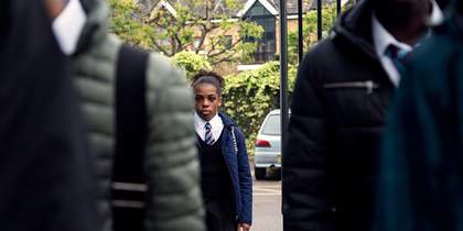 A young person in school uniform