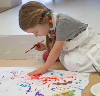Child painting at Tate Liverpool workshop