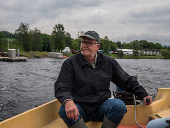 Lars Hvinden in his boat on Randsfjorden, Røykenvik
