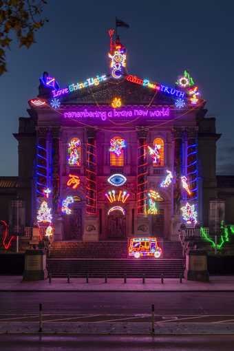 The facade of Tate Britain is lit up with Chila Kumari Singh Burman's Winter Commission 