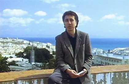 Photo of a man against a Moroccan backdrop (Tangier)