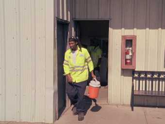 Kevin Jerome Everson, Workers Leaving the Job Site 2013, film still. 