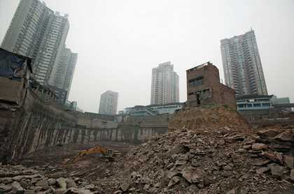 Wu Pings house in Chongqing China after she refused to move for a property project in 2007 a photograph of a lone house in the middle of demolition site