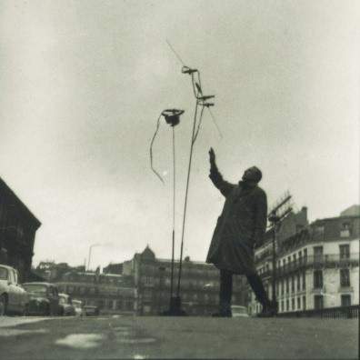 Takis lighting his Firework Signal (Signaux feux d’artifice) in front of Montparnasse Station, Paris, 1957. Photo: Martha Rocher