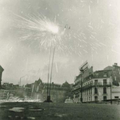 Takis lighting his Firework Signal (Signaux feux d’artifice) in front of Montparnasse Station, Paris, 1957. Photo: Martha Rocher