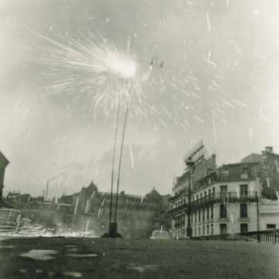 Takis lighting his Firework Signal (Signaux feux d’artifice) in front of Montparnasse Station, Paris, 1957. Photo: Martha Rocher