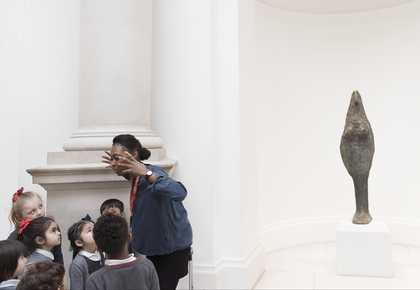 Artist leading schools session in gallery
