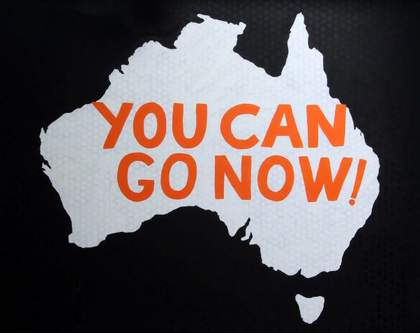 Painting by artist Richard Bell of the Australian map with words You Can Go Now written across it.