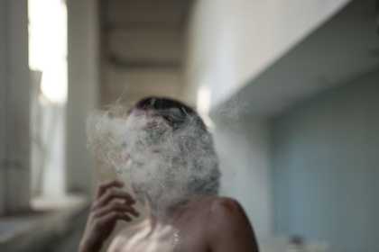 woman with smoke covering her face
