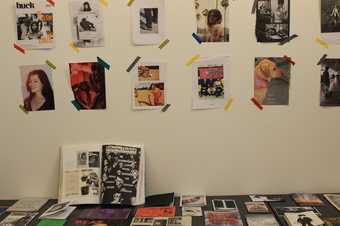 Zines on a table and wall
